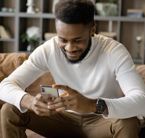 Image of a man texting.